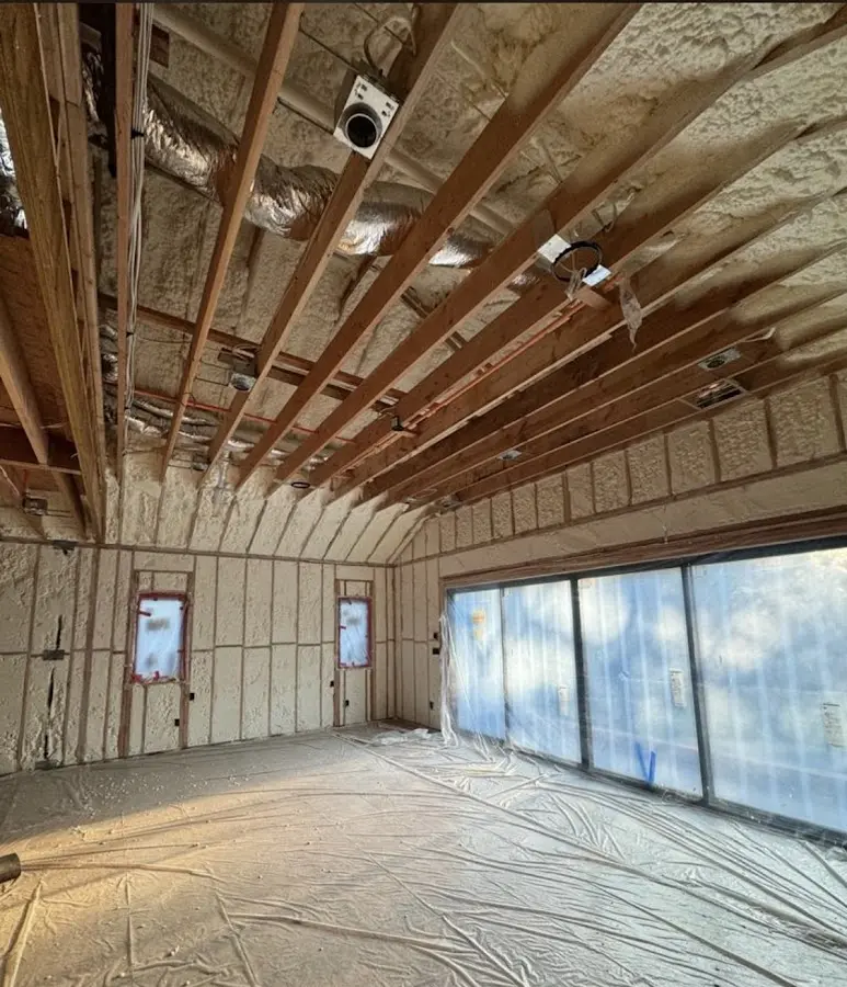 Interior walls and ceiling insulated with spray foam during new construction in Huntersville